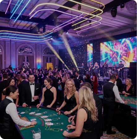 Vibrant Las Vegas–style event: neon lights, large screen, guests at green casino tables